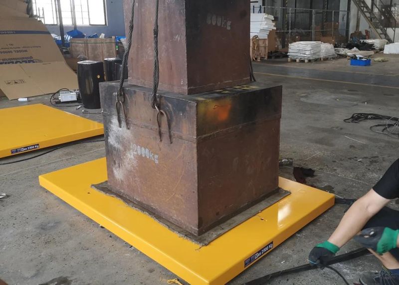 Low-Profile Powered Lift Table with Access Ramp to Load-Unload Palets Without a Pit