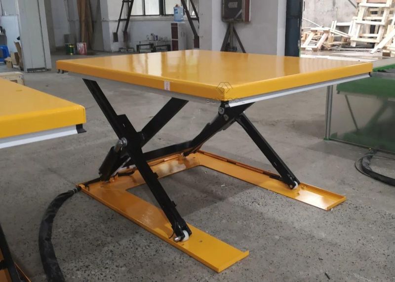 Low-Profile Powered Lift Table with Access Ramp to Load-Unload Palets Without a Pit
